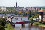 Vorschaubild für Datei bild-hafen oldenburg.jpg Skyline von Oldenburg Stadthafen Eisenbahnbrücke
